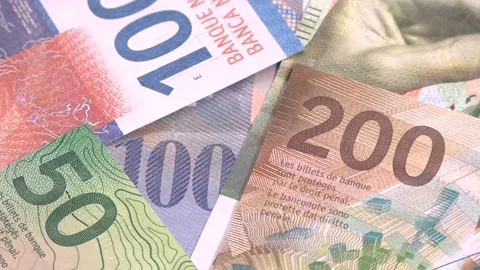 Swiss money on table stop motion Stock Footage 145524612