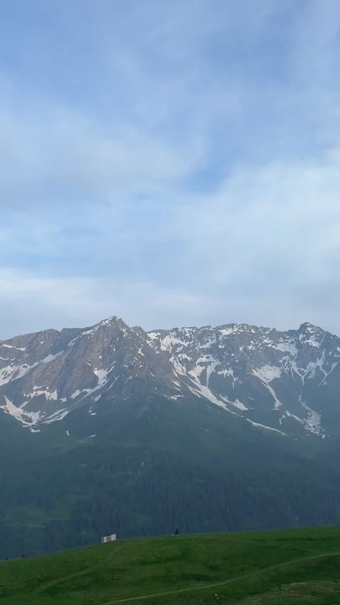 Swiss Mountain Landscape in Mobile Format — Green Meadows and Distant Alps Stock Footage 311404959