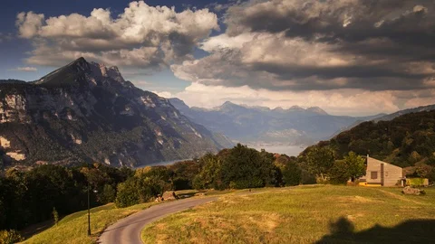 Swiss Mountain Range 4K Timelapse at Sunset by Walensee Lake Stockbeeldmateriaal 94889719