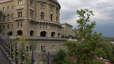 Swiss Parliament with dramatic sky background, pedestal establishing shot Stock Footage 283494287