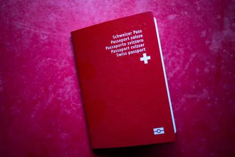 Swiss passport on red background Stock Photos