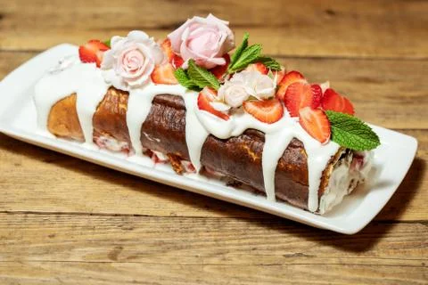 Swiss roll cake with fruit Stock Photos