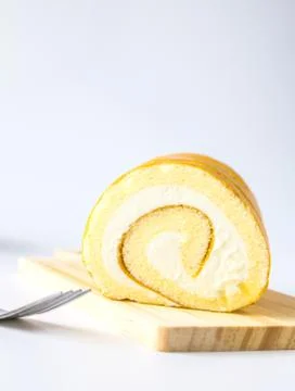 Swiss roll on white background. Stock Photos