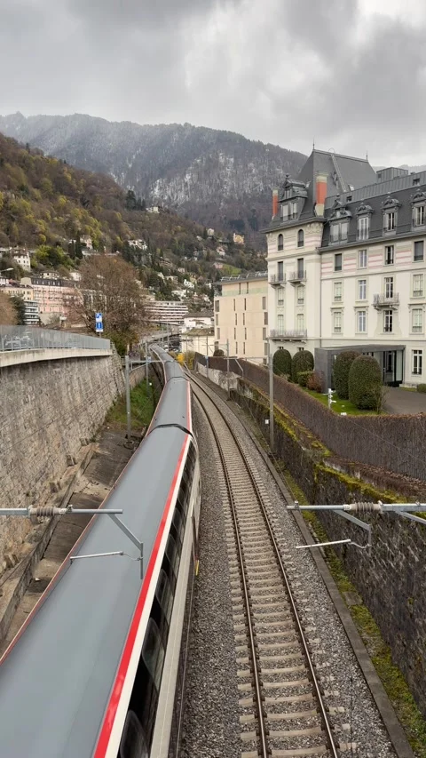 Swiss SBB train passing through Montreux railway, residential area 库存影片 331737707
