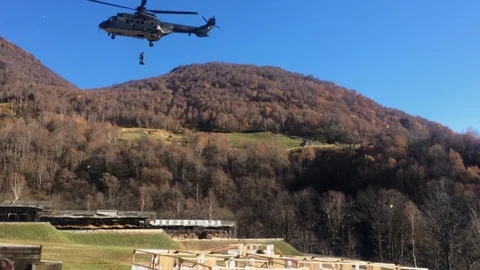 Swiss Soldier roping down a Super Puma in Isone, Switzerland Stock Footage 121978792