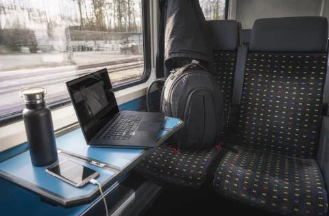 Swiss train interior with modern technology. Train traveling concept. Stock Photos