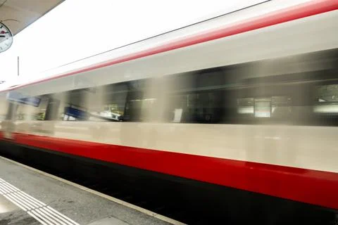 Swiss Train Passes By At Speed 库存照片