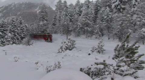 Swiss Train Ploughing Through The Snow Stock Footage 508076