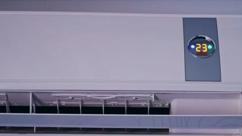 Switch air conditioning mode to blow cool air changing room temperature Stock Footage 261082473