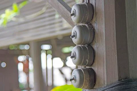 Switch on the ancient black light attached to the black wooden pole. Stock Photos