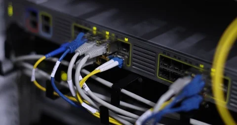 Switch And Optic Cable Connected To Network Panel With Blinking Leds Stock-Footage 117630776