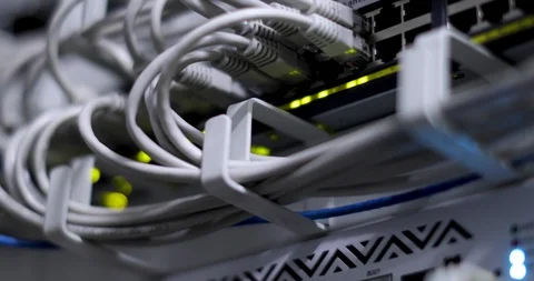 Switch And Optic Cable Connected To Network Panel With Blinking Leds Stock Footage 117630797