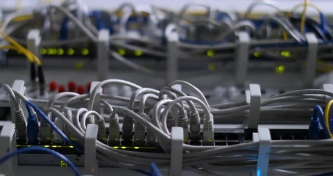 Switch And Optic Cable Connected To Network Panel With Blinking Leds Stock-Footage 117630808
