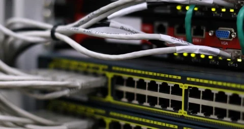 Switch And Optic Cable Connected To Network Panel With Blinking Leds Stock-Footage 117630853