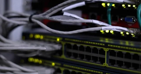 Switch And Optic Cable Connected To Network Panel With Blinking Leds Stock-Footage 117630859