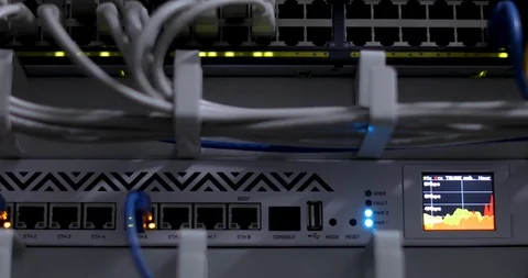 Switch And Optic Cable Connected To Network Panel With Blinking Leds Stock Footage 117630885