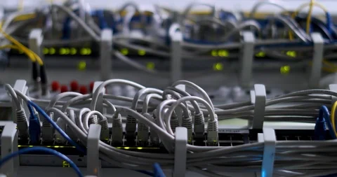 Switch And Optic Cable Connected To Network Panel With Blinking Leds Stock Footage 117630932