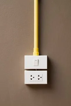 Switch and sockets on dark brown wall Stock Photos