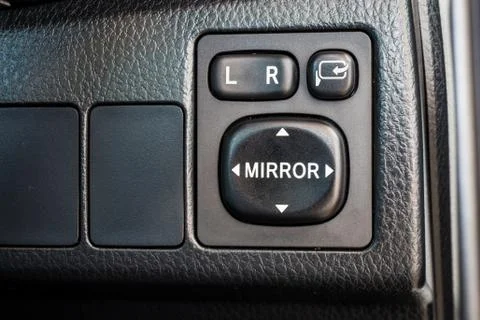 Switch button adjust or controls side mirrors in a car Photos