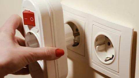 Switch. Button on and off. Hand presses the button. Stock Footage 129859025