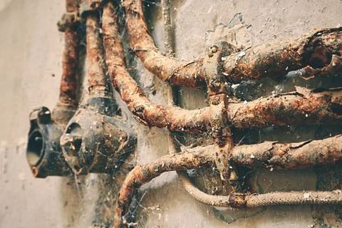 On-off switch button with rusty cables on the wall Stock Photos