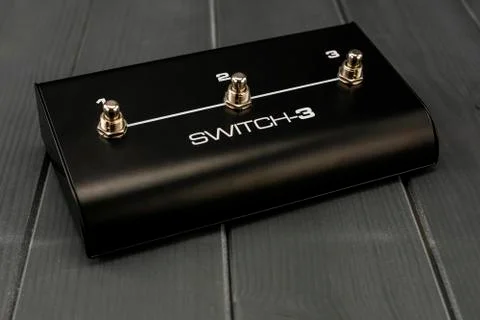 Switch effects pedal with three guitar processes Stock Photos