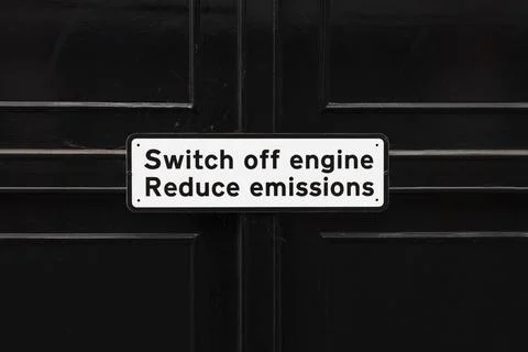 Switch Off Engine Sign on Dark Gate, Environmental Reminder to Reduce Emissions Stock Photos