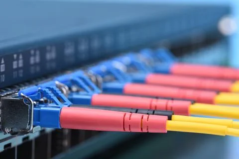 Switch with fiber optic cables in data center Stock Photos