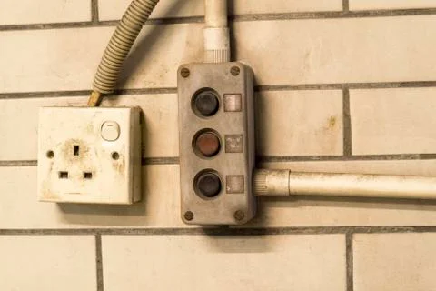 Switch the power outlet with the switch to open the door very old. Stock Photos