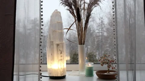 Switch on rough big selenite crystal tower pole lamp illuminated on home window. Stock-Footage 170002506