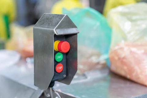 Switch start stop and emergency button for control conveyor. Stock Photos