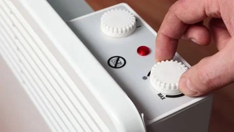 Switch off thermostat dial of convector radiator heater for control temperature. Stock Footage 234865530