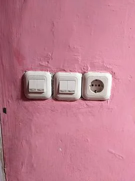 The switch to turn on the bathroom light Stock Photos