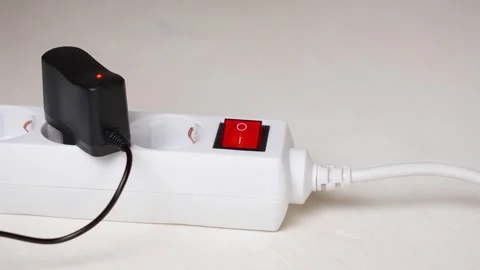 Switch white surge protector with a red button Stock Footage 321470921