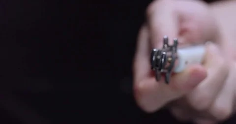 A switchblade snaps open with the tip into focus at the camera Stock Footage 71782979