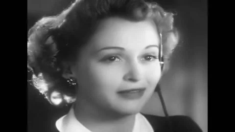 A switchboard operator handles phone calls and sings in this 1940s soundie Vidéo 152663689