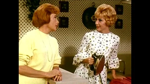 A switchboard operator is irritated by her boss who is slow to answer her call Stock Footage 95598719