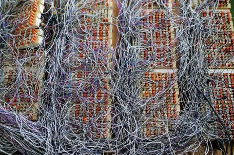 Switchboard panel in datacenter with messy cables connections Foto stock