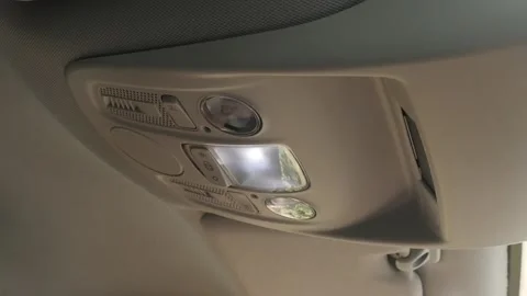 Switched OFF passenger side ceiling light slow-mo video Stock Footage 94212058