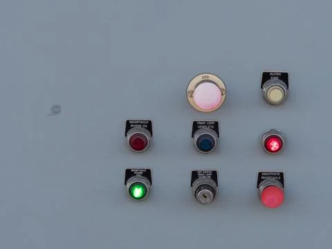 Switches and toggles on a control panel flashing various lights Stock Photos