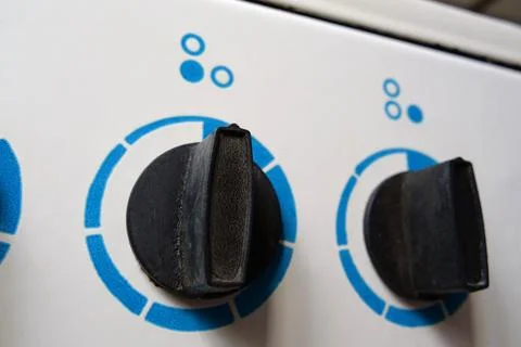 Switches of burners of old Soviet kitchen electric stove Stock Photos