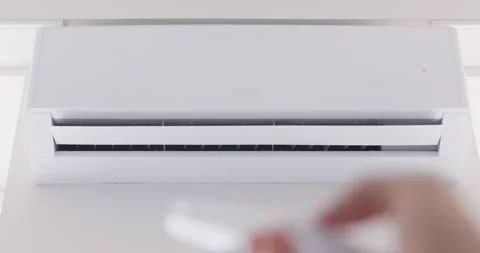 Switching on air conditioner close up, blowing warm, cold air room temperature Stock Footage 288874065