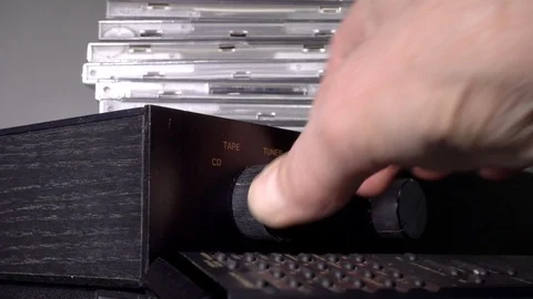 Switching an amplifer to CD play, then turning up the volume. Stock Footage 114371122