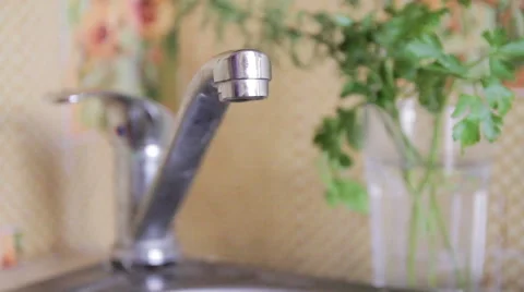 Switching on and off the tap Stock Footage 48489506