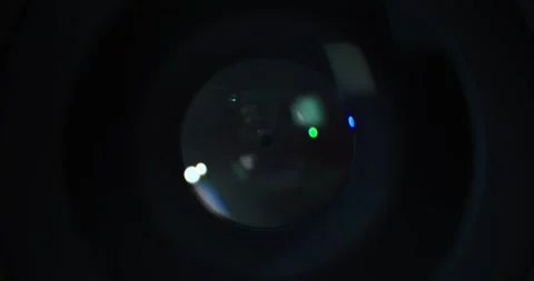 Switching aperture on  a camera lens from a small f 1.4 to a large f 22 Stock Footage 169093991