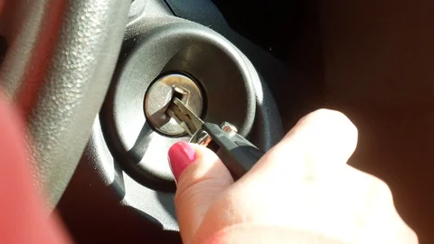 Switching on a car key to start an engine Stock Footage 118857834