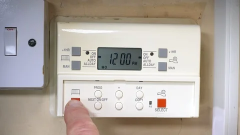 Switching on central heating and hot water programmer / timer. Video stock 129214311