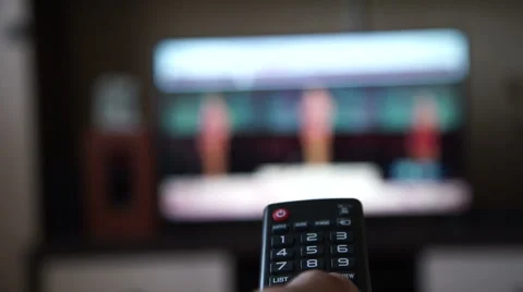 Switching channels on the TV Video stock 55302542