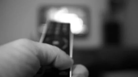 Switching channels on tv with remote control Stock Footage 50054496