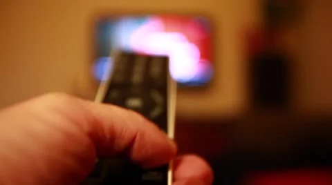 Switching channels on tv with remote control Stock Footage 50054596